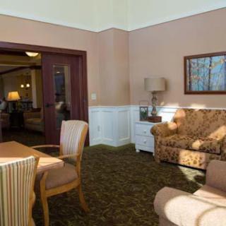 A cozy and inviting living room area, featuring comfortable furniture and warm lighting.