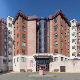 A multi-story residential building with a modern architectural design.