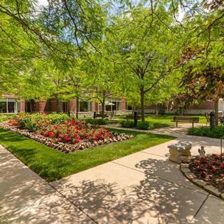 A beautifully landscaped garden with vibrant flowers and lush greenery.