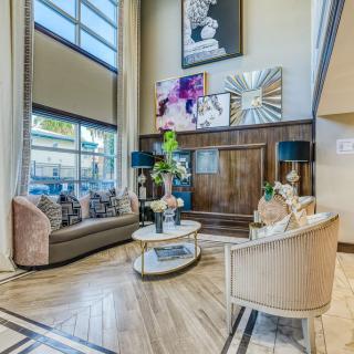 A modern living room with contemporary furniture and artistic wall dcor.
