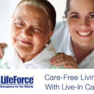 A caregiver smiling with an elderly woman, promoting live-in care services.
