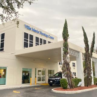 Exterior view of a healthcare facility, showcasing modern architecture and landscaping.