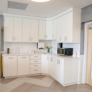 A modern kitchen with white cabinets and a clean, minimalist design.