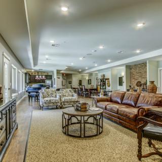 Spacious and elegant living room with comfortable seating and stylish decor.