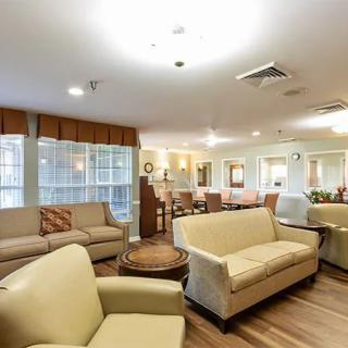 A spacious living room with comfortable seating and modern decor.