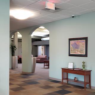 A view of a lobby area featuring seating and wall artwork.