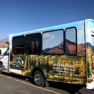 A scenic bus featuring a beautiful mountain landscape.