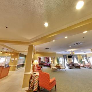 Spacious lobby area with comfortable seating and warm lighting.