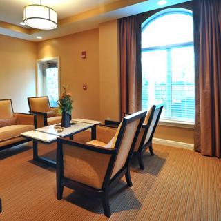 A cozy living room with elegant furniture and a large window.