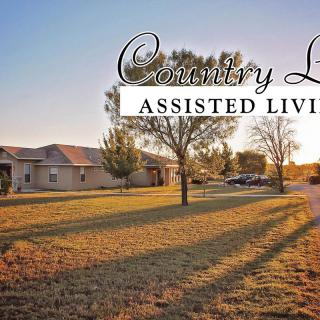 A serene country setting with an assisted living facility at sunset.