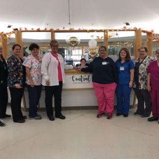 A dedicated team of healthcare professionals gathered together at their workplace.