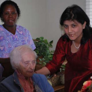 Caregivers providing support and companionship to elderly individuals.