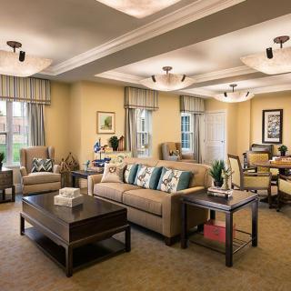 A spacious and cozy living room with modern decor and neutral tones.