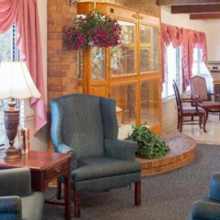 A cozy living room with comfortable chairs and soft lighting.