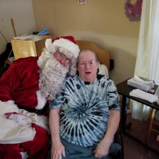 A cheerful moment with Santa Claus during the holiday season.