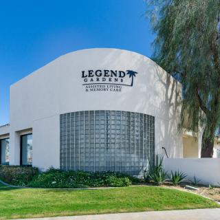 A photo of a commercial building labeled 'Legend Estates' with modern architecture and landscaping.