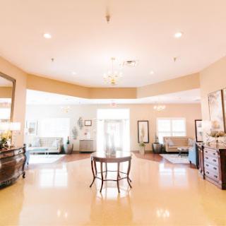 A spacious and inviting lobby featuring comfortable seating areas and elegant decor.