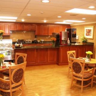 A cozy kitchen and dining area with wood furniture and modern design.