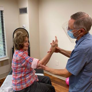 A healthcare professional administering a vaccine to a patient in a clinic.