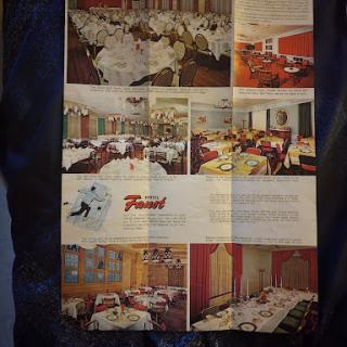 A glimpse into the elegant dining areas of a restaurant, showcasing beautifully set tables and tasteful decor.