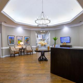 A modern reception area with seating and elegant decor.