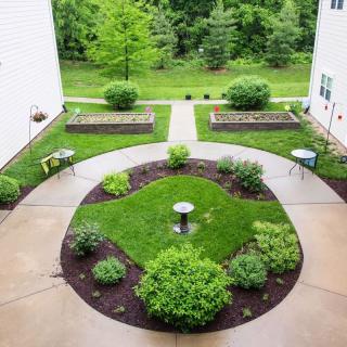 A landscaped courtyard with pathways and greenery.