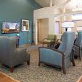 A cozy living room with comfortable seating and a television.