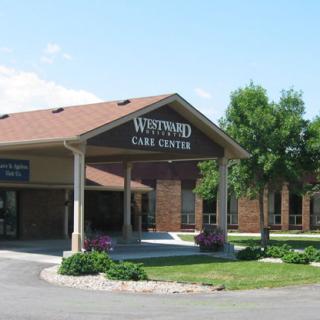 The exterior view of a healthcare facility labeled 'Westwind Care Center' with surrounding landscaping.