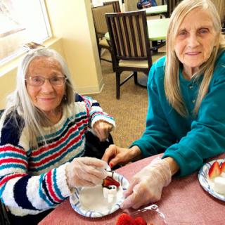 Enjoying a fun cooking activity together at the care home.