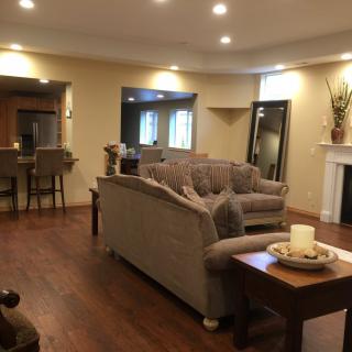 A cozy living room with comfortable seating and a fireplace.