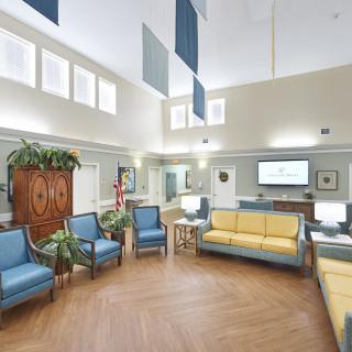 A modern waiting room with comfortable seating and natural light.