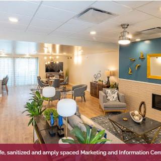 A stylishly designed and spacious Marketing and Information Center, featuring modern furniture and a welcoming atmosphere.