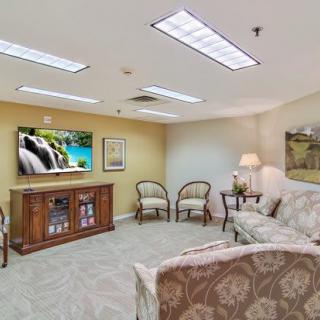 A cozy living room with comfortable seating and a television.