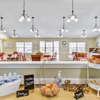 A welcoming breakfast area with pastries, beverages, and a comfortable dining space.