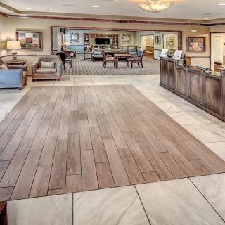A spacious and elegantly designed lobby with comfortable seating and a welcoming reception desk.