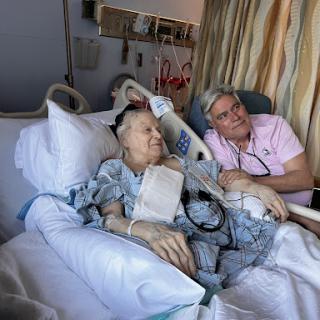 A touching moment between a patient and their loved one in a hospital setting.