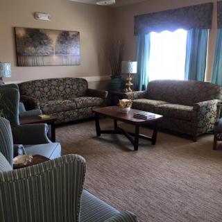 A cozy living room with sofas and a coffee table.
