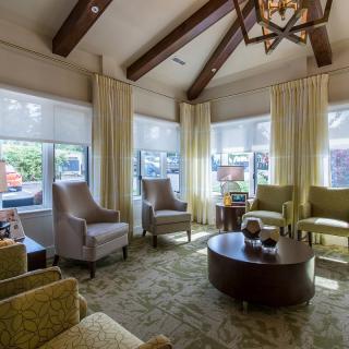 A cozy living room with comfortable seating and ample natural light.