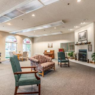 A spacious living room with comfortable seating and a cozy fireplace.