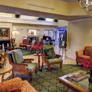 A cozy and elegantly decorated living room with various seating arrangements.