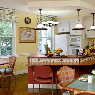 A cozy kitchen and dining area with warm lighting and inviting decor.