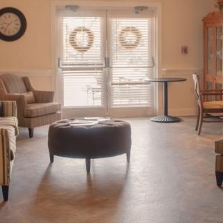 A cozy living room with comfortable seating and natural lighting.