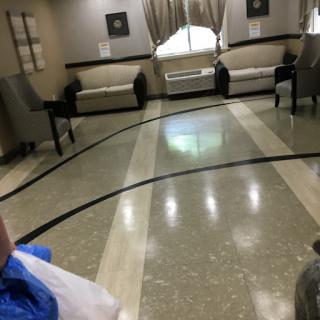 A cozy lobby area featuring elegant couches and a polished floor.