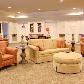 A cozy living room with comfortable seating and soft lighting.