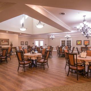 A spacious dining area with elegant decor and ample seating.