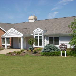 A suburban house with a well-maintained lawn and a welcoming exterior.