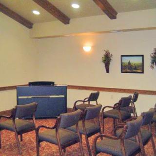 A cozy meeting room with seating arranged for discussions.