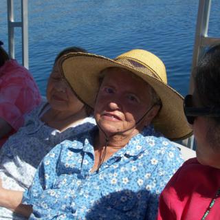 People relaxing on a boat under the sun.