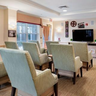 A cozy living room with comfortable chairs facing a television.