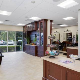 A modern and bright salon interior with a reception area and stylish furniture.